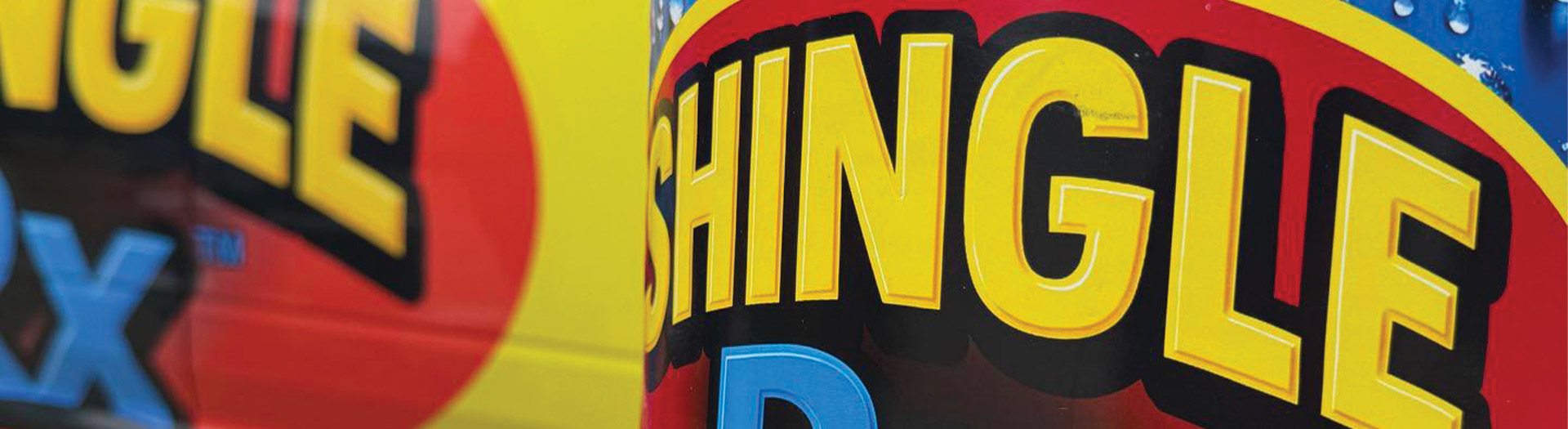 Close up of Shingle RX branded truck wrap logo showing bold yellow and red branding representing free Florida roof rejuvenation estimate and quote