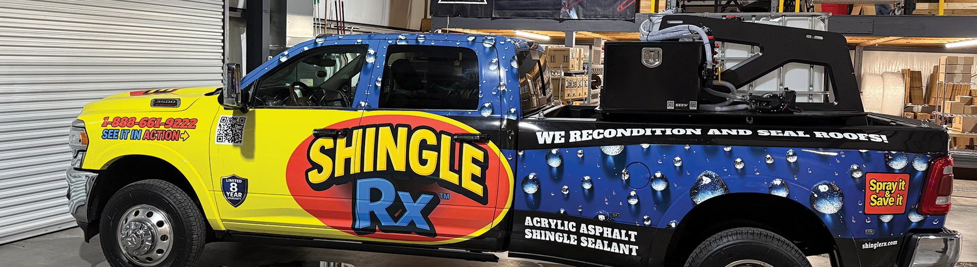 Shingle RX branded service truck with acrylic asphalt shingle sealant wrap parked in warehouse representing licensed and insured Florida roof rejuvenation contractor