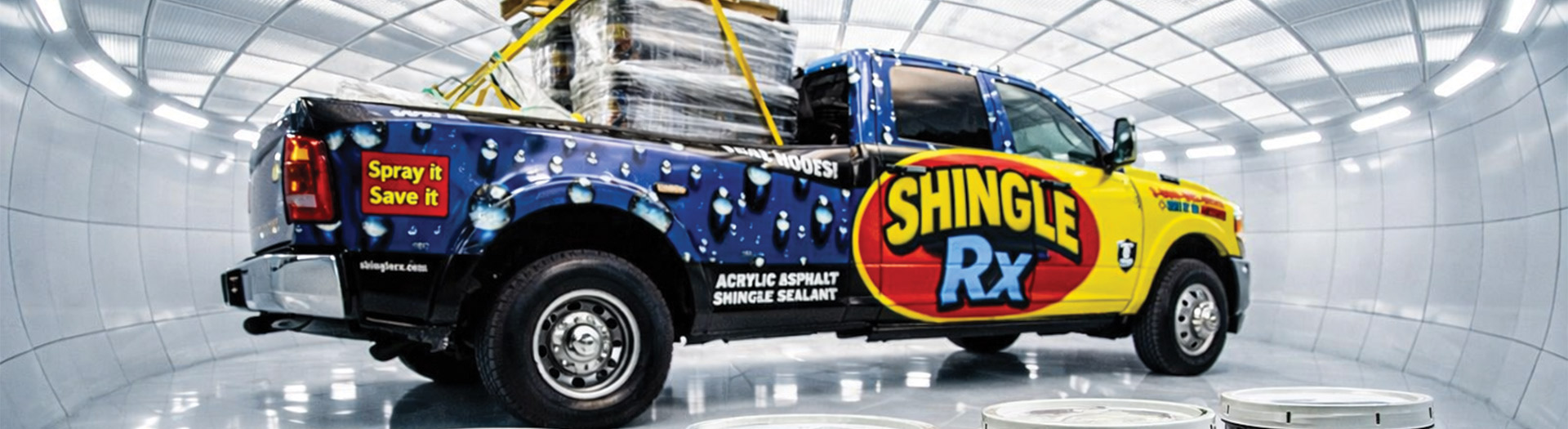 Shingle RX roof rejuvenation service truck and sealant buckets in professional studio setting showing Florida roof treatment equipment