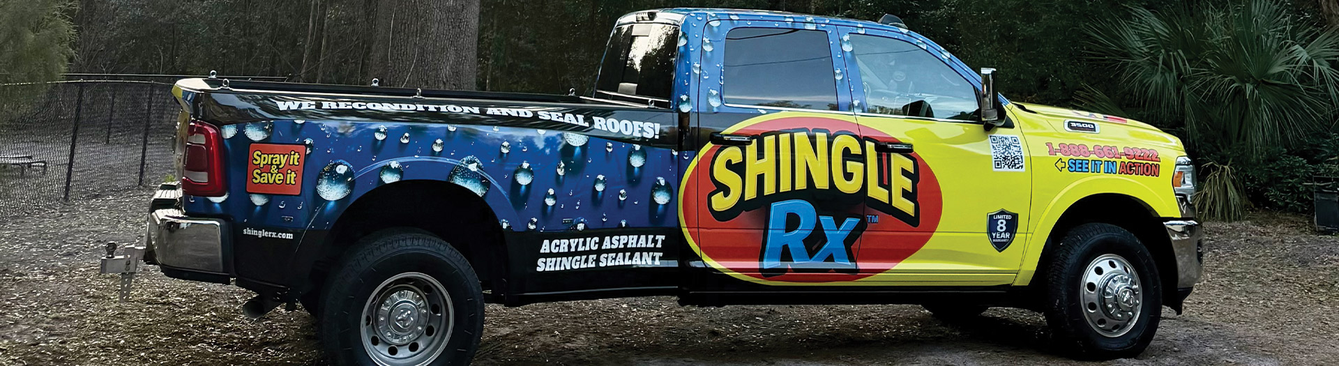 Shingle RX branded service truck parked under Florida live oak tree at sunset representing sun and algae roof defense